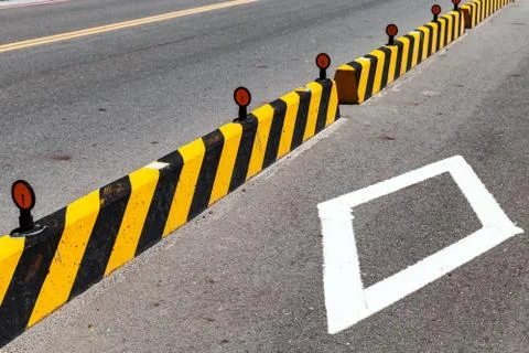 Concrete blocks with striped caution pattern Stockfoto's