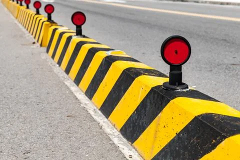 Concrete blocks with striped caution pattern Stockfoto's