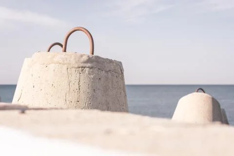 Concrete breakwaters in the foreground Stock-Fotos