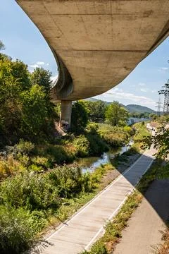 Concrete bridge over quiet stream. Фото
