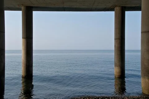 Concrete bridge over the sea, close-up of the bridge. Stock Photos
