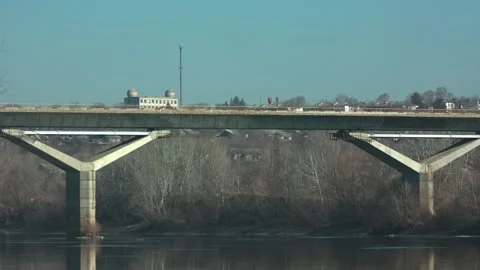 Concrete Bridge Spanning a River in Early Spring Stock Footage 313694448