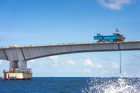 Concrete bridge under construction over ocean waters in Maldives Stock Photos