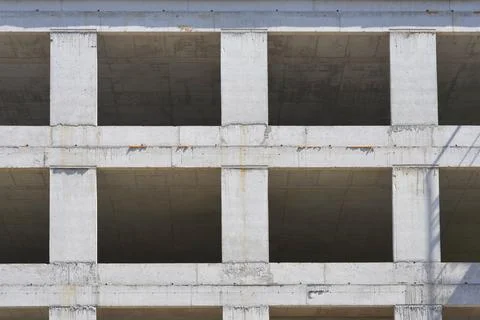 Concrete building construction site with open window frames Stock Photos