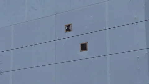 Concrete building face. Muted colors with openings. Industrial concrete exterior Stock Footage 330026105