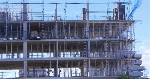 Concrete building structure under construction with scaffolding and formwork 스톡 동영상 336301138