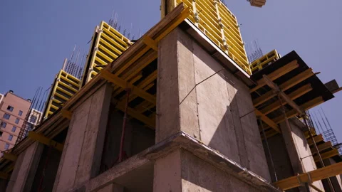 Concrete building structure with yellow slab formwork under construction Stock Footage 346551130