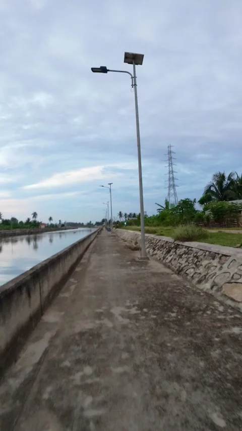 Concrete Canal Path with Solar Lights Stock Footage 325391237