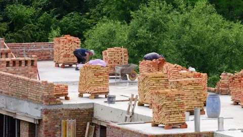 Concrete ceiling of a brick house under construction. Construction site.  動画素材 313337701