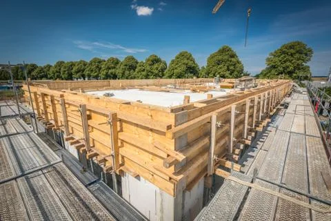 A concrete column is placed on a foundation Stock Photos