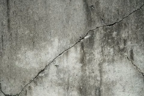 Concrete crack texture background texture. Grey crack wall Foto stock