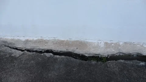 Concrete cracks highlight damage in a building area Stock Footage 337226161