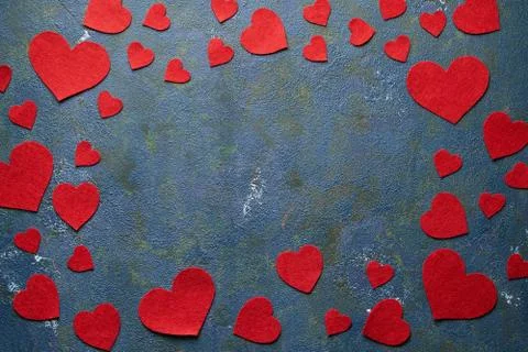 Concrete creative background with copy space and red heart made of wool for Stock Photos