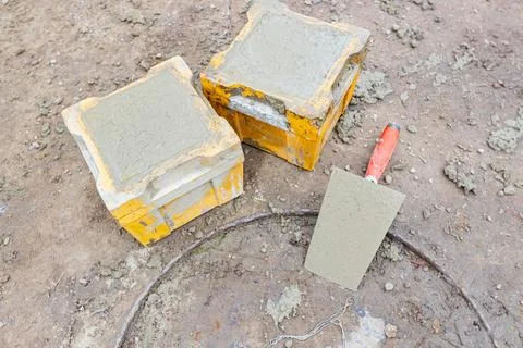 Concrete cube molds for compressive strength test of the cement mixture Stock Photos