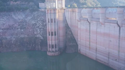Concrete dam low level in Spain and drying up water during drought season. Stock Footage 265304964