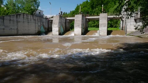Concrete dam at Olt river, flooded dirty water Stock Footage 108648741