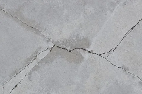 Concrete with diagonal cracks. Foto stock