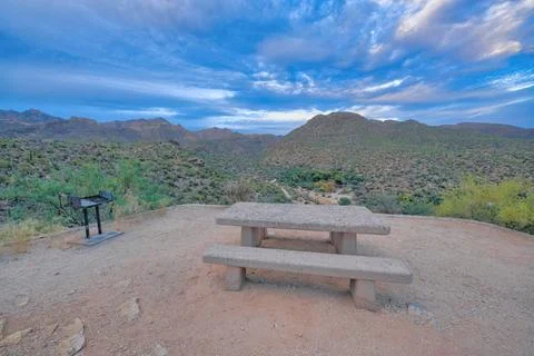 Concrete dining table and in ground grill on a camp site at Sabino Canyon Sta Stock Photos