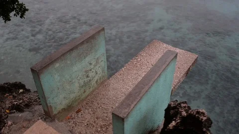 Concrete diving board over Turquoise sea and tropical beach Stock Footage 123217411