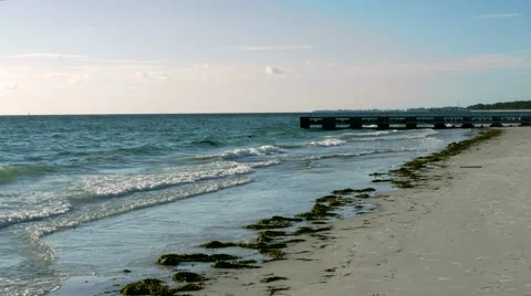 Concrete Dock Protrudes from Beach, 4K Stock Footage 54089268