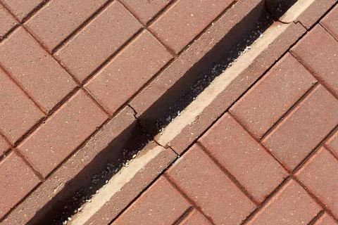 Concrete drainage gutter on the sidewalk. View from above. Foto stock