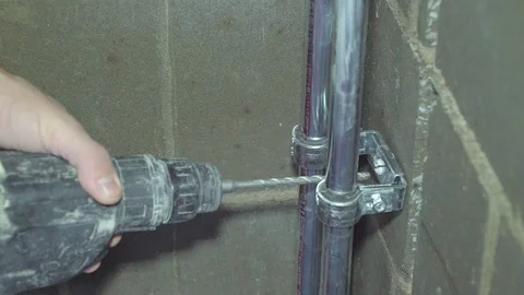 Concrete, electric drill,Close up hands hold electric drill in room, Stock Footage 86523245