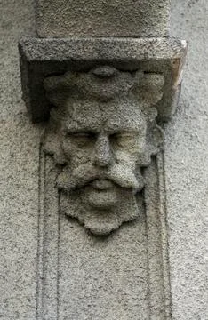 Concrete face on a wall Stock Photos