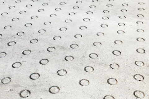 Concrete flooring with round relief pattern Stock Photos