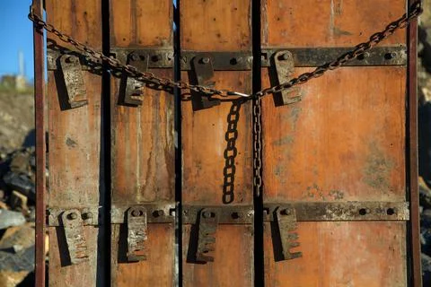Concrete forms on construction site orange wood metal chains and lock Stock Photos