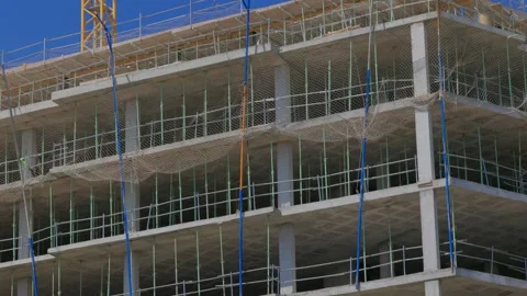 Concrete frame build with nets and scaffolds Video stock 323846448