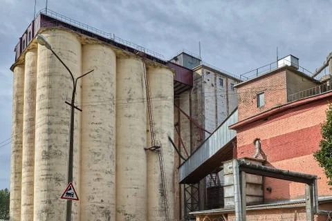 Concrete grain elevator of silo type on baking production faktory. Stock Photos