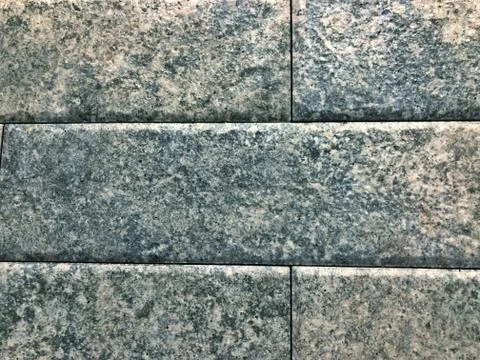 Concrete gray brick wall close-up. Stock Photos