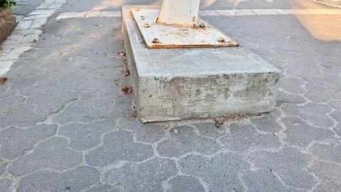 Concrete Light Pole Base on Urban Paved Sidewalk in Daylight Stock Footage 340001216