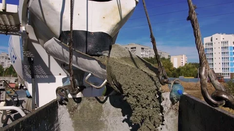 Concrete in liquid form is poured from a concrete mixer Stock Footage 242590497