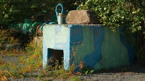 A concrete military defensive structure stands amidst the natural landscape. Stock-Footage 345626652