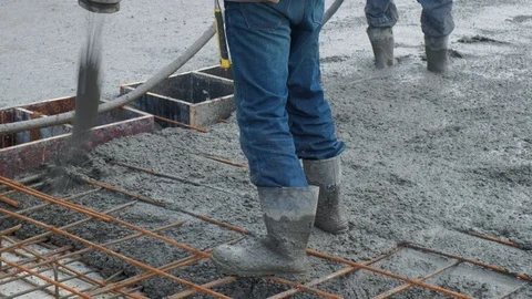 Concrete mix poured into framework Stock Footage 102343716