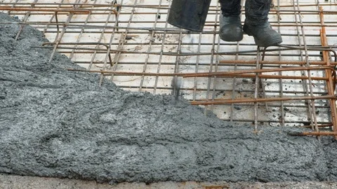 Concrete mix poured into framework Stock Footage 102343719