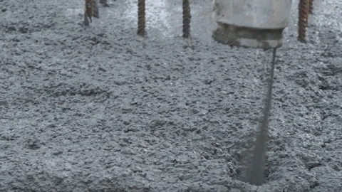 Concrete mix poured into framework Stock Footage 102343747