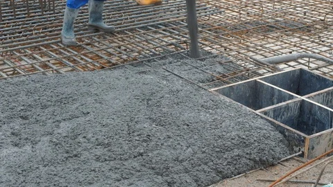 Concrete mix poured into framework Stock Footage 102343797