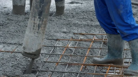 Concrete mix poured into framework Stock Footage 102343802