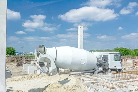 Concrete mixer passing over building site Fotos de archivo