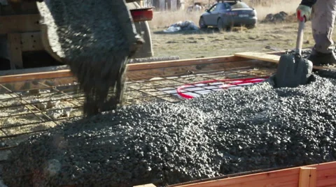 Concrete mixture flows to the plate Stock Footage 60365464