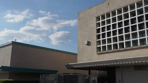 Concrete Office Building And Clouds In The Sky HD Video stock 41509797
