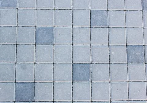 Concrete or cobble gray square pavement slabs or stones for floor, wall or path Stock Photos