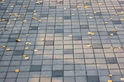 Concrete or cobble gray square pavement slabs or stones for floor, wall or path Stock Photos