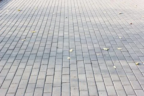 Concrete or cobble gray square pavement slabs or stones for floor, wall or path Stock Photos