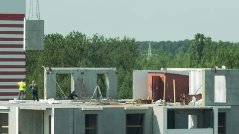 Concrete Panel Descends From Crane To Workers. Construction Site Prepares For Video stock 325298615