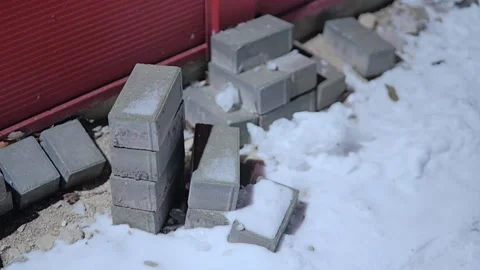 Concrete Paving Blocks Stacked on Snowy Construction Site in Winter, Latvia Stock Footage 340304261