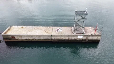 Concrete pier with observation tower on water 스톡 동영상 337809987