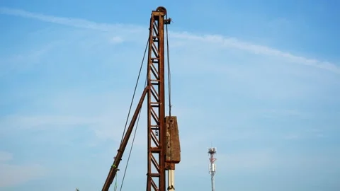 Concrete pile is being driven into the ground at construction site Stock-Footage 220904509